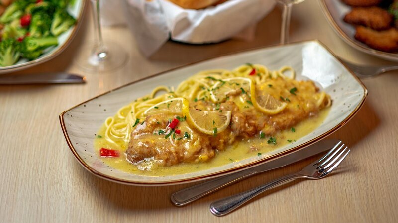 Chicken francese entree with side of pasta
