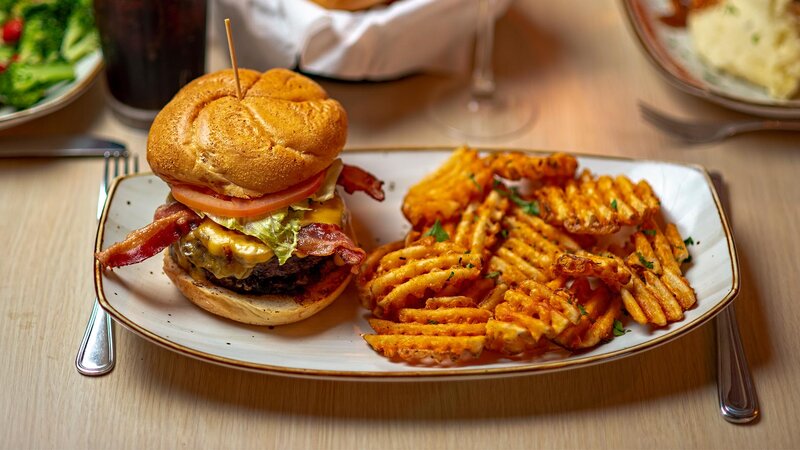 Bacon cheeseburger with side of waffle fries